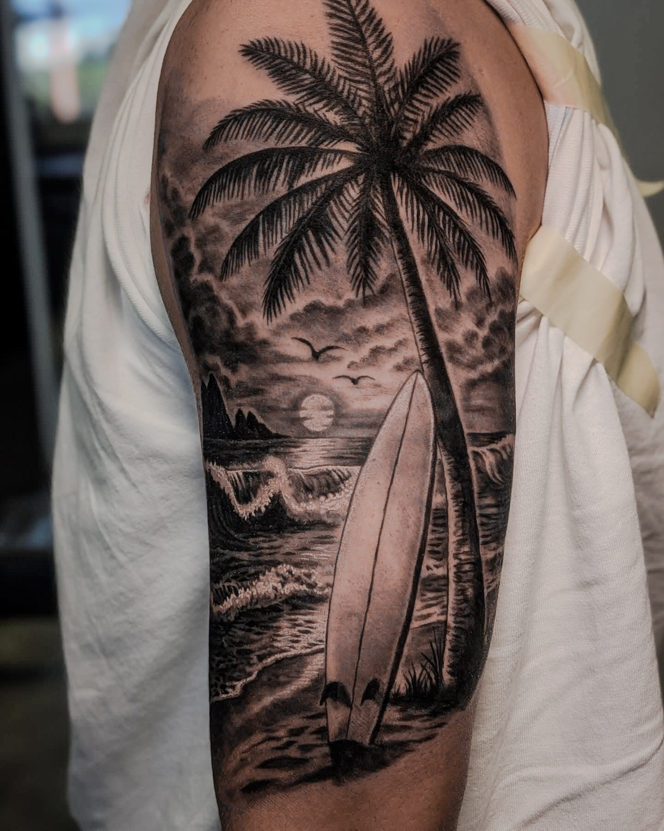 black-and-grey-beach-surfboard-tattoo-christchurch