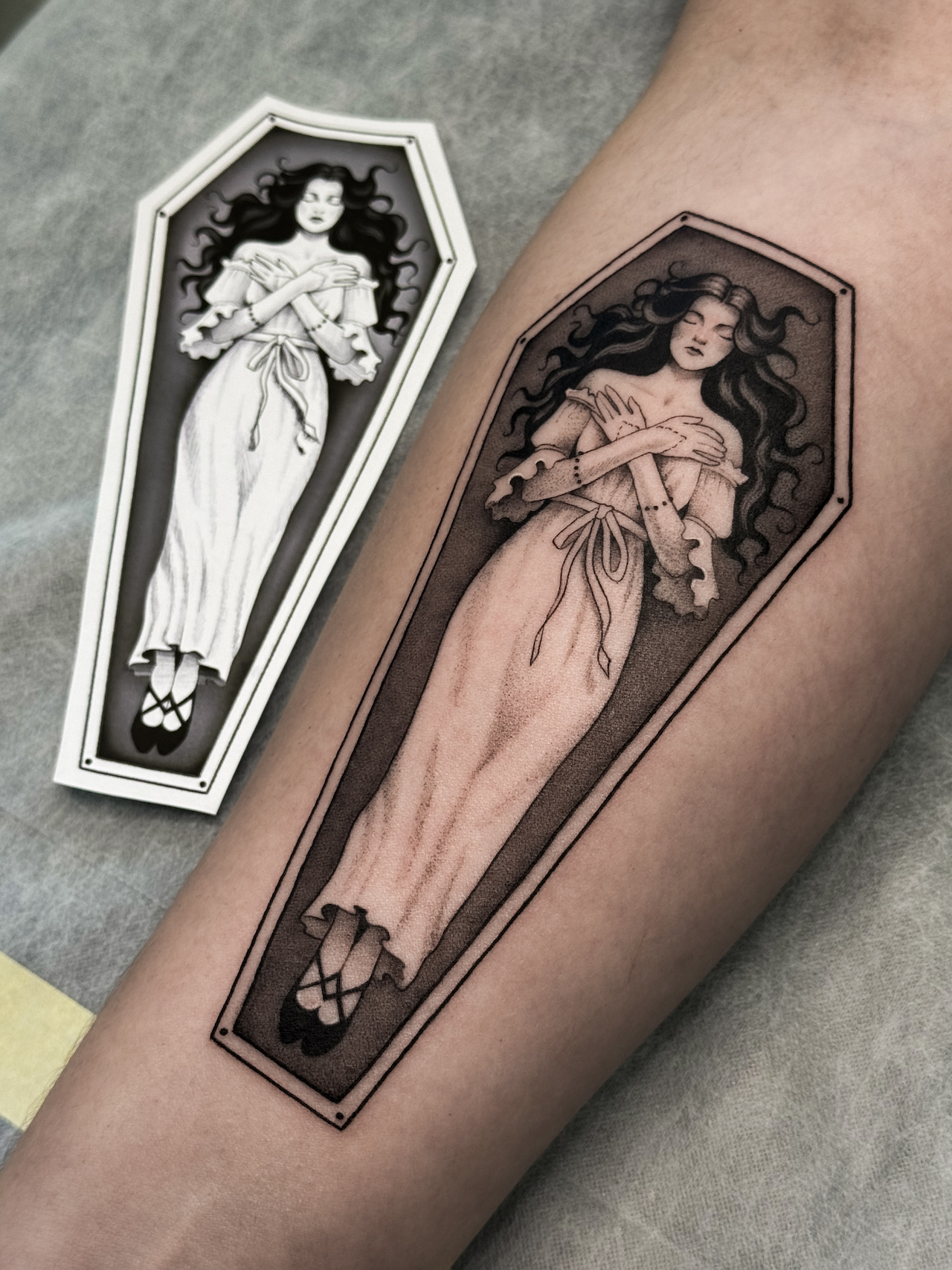 black-and-grey-lady-in-coffin-tattoo-christchurch