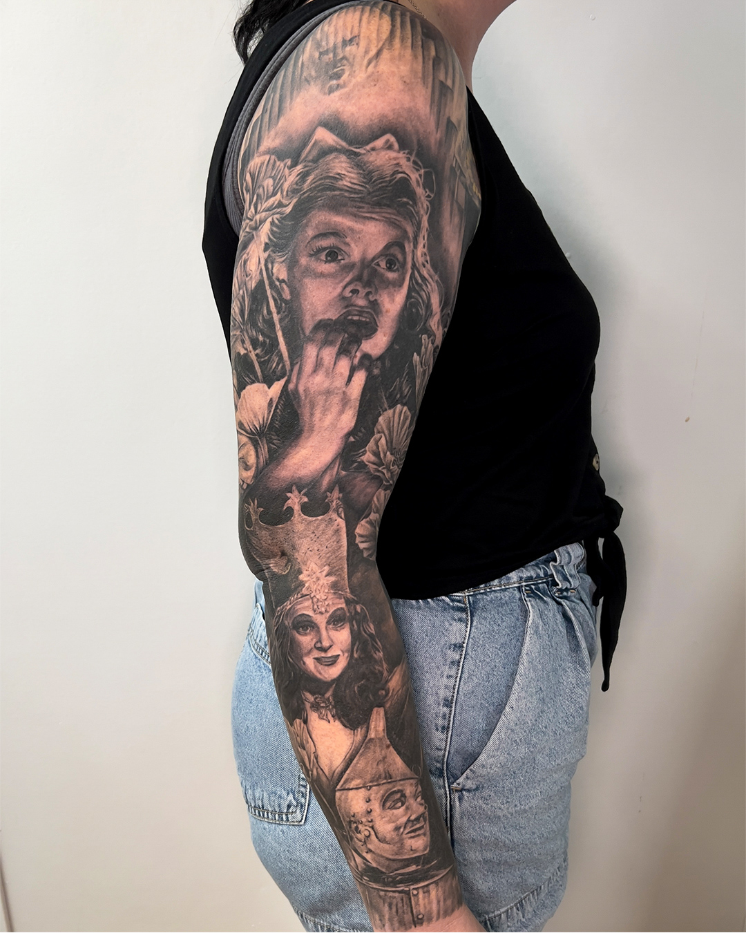 black-and-grey-wizard-of-oz-sleeve-tattoo-christchurch