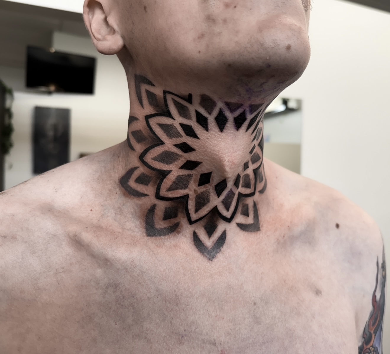 Mandala Throat Tattoo