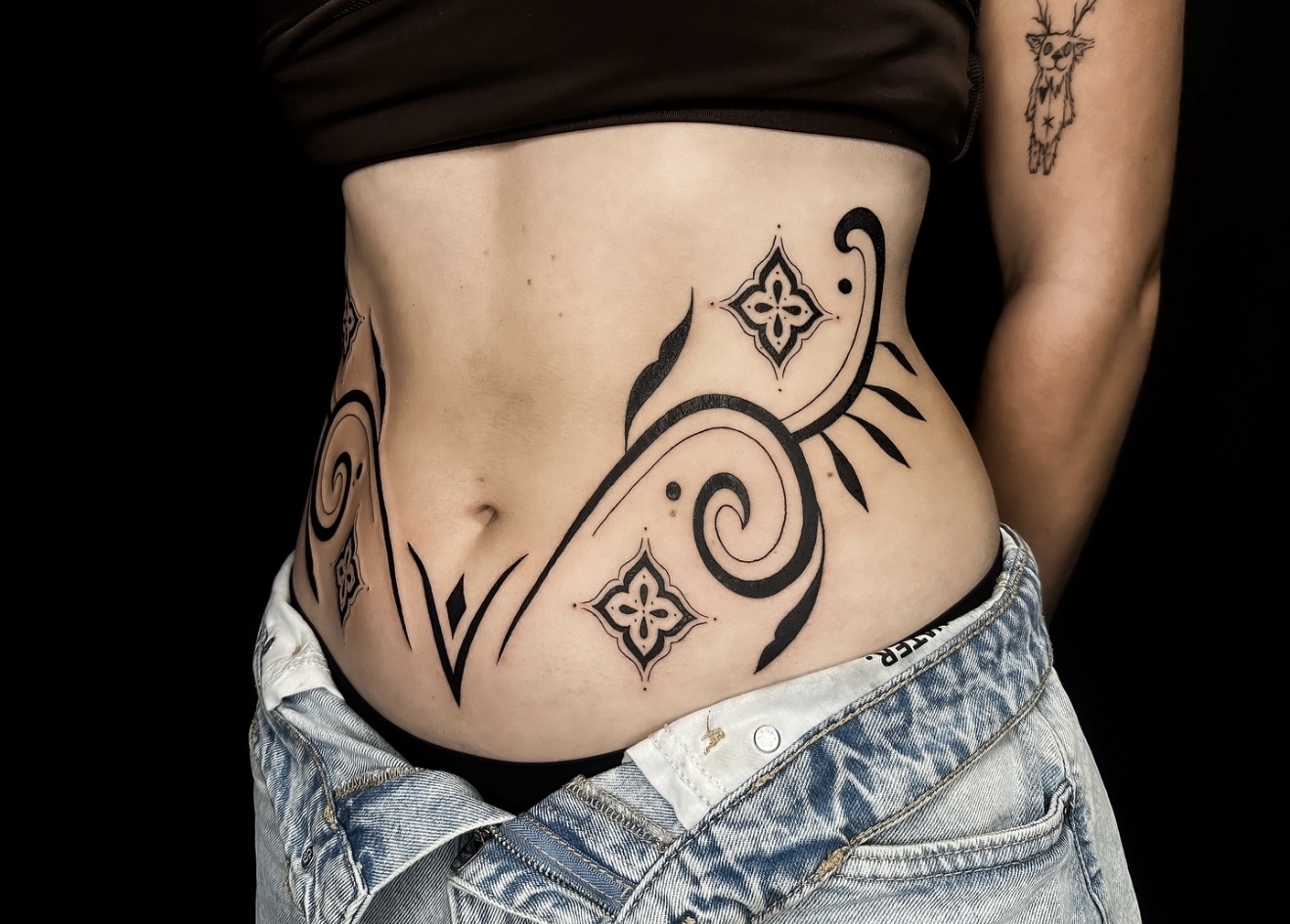 Ornamental lower stomach Tattoo