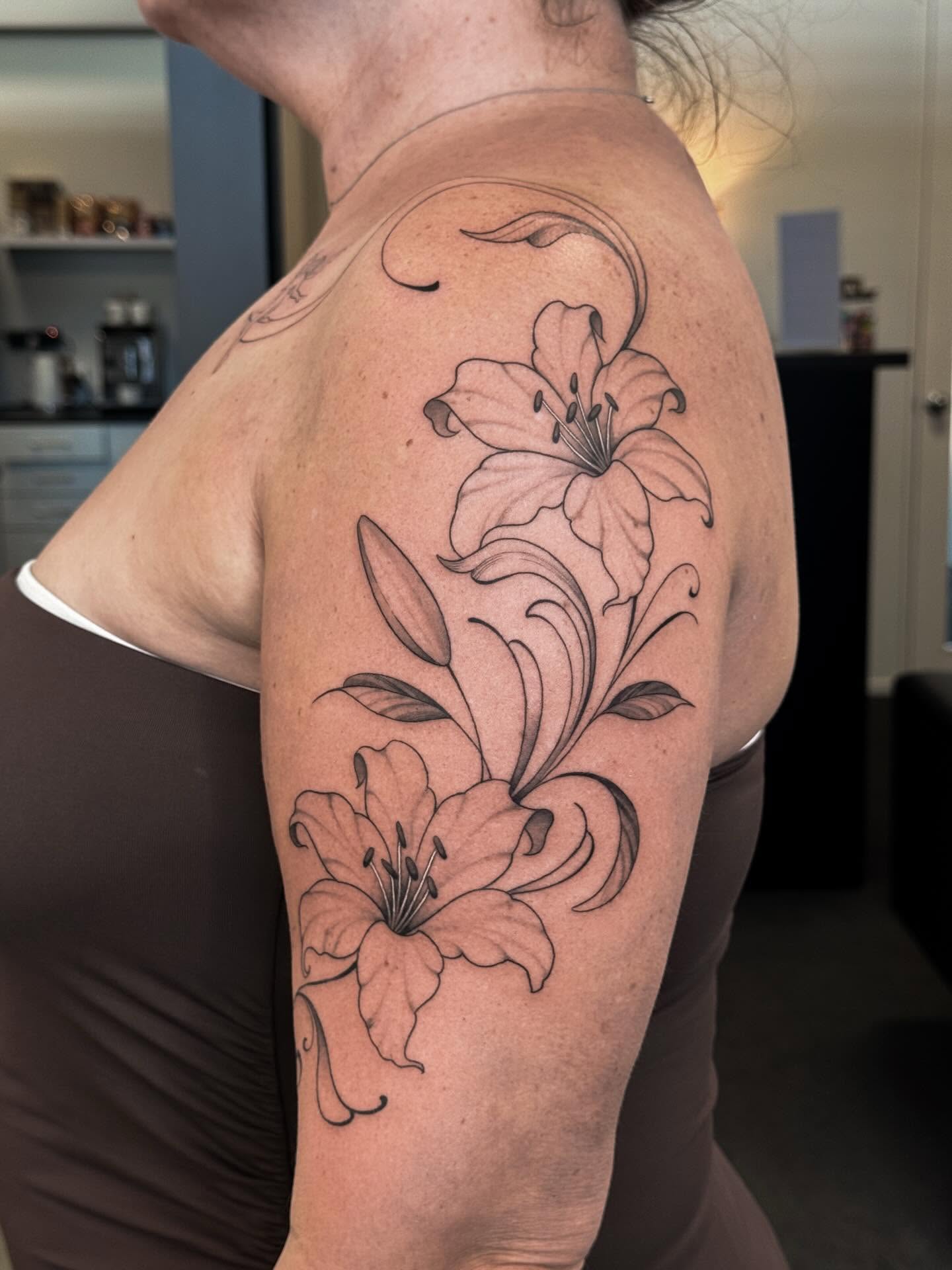 upper-arm-lily-tattoo-christchurch