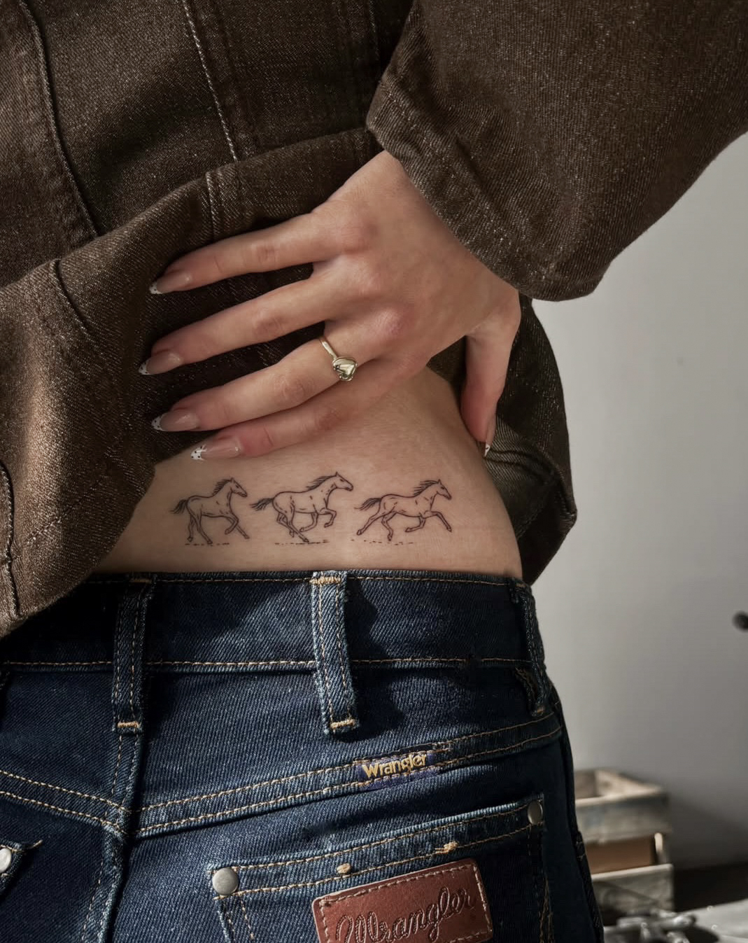 wild-horses-lower-back-tattoo-christchurch