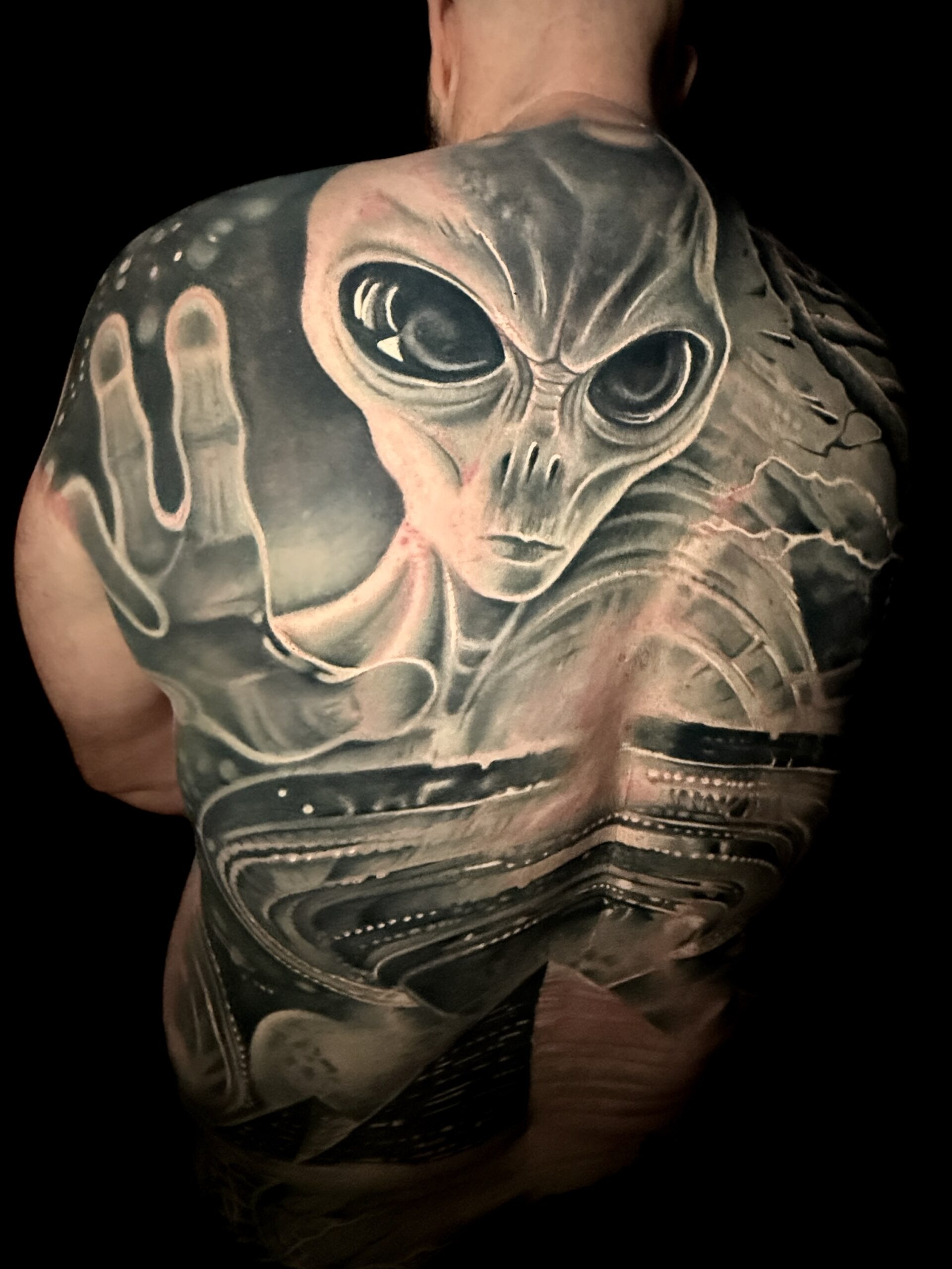 black-and-grey-alien-back-piece-tattoo-christchurch-nz