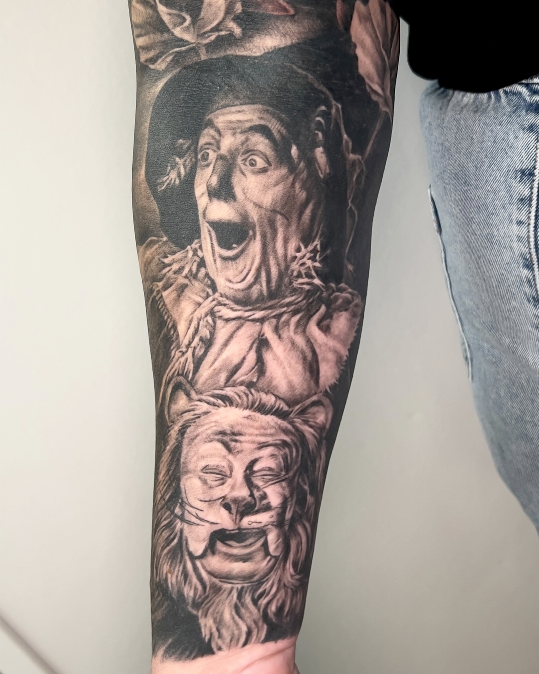 black-and-grey-realism-wizard-of-oz-sleeve-tattoo-christchurch