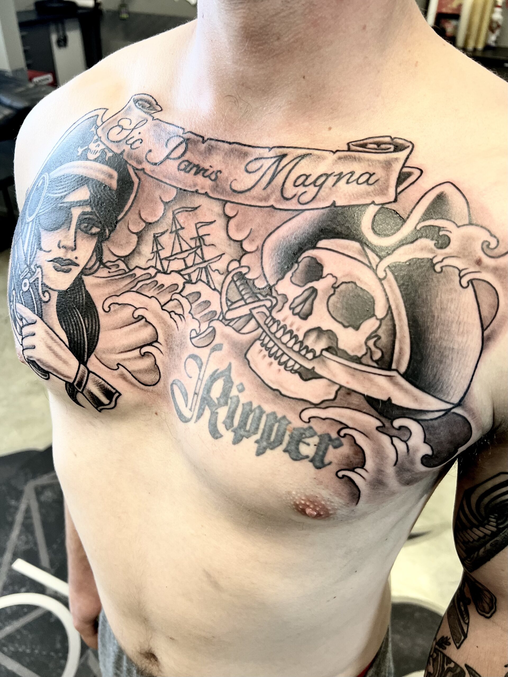 black-and-grey-traditional-chest-piece-tattoo-christchurch